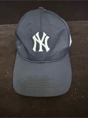 New York Yankees baseball cap featuring a promotional patch for WFAN